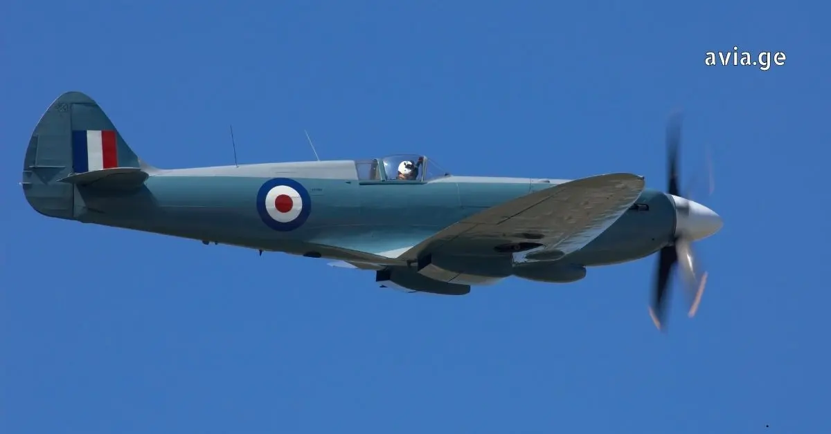 Supermarine Spitfire flying against a clear blue sky.
