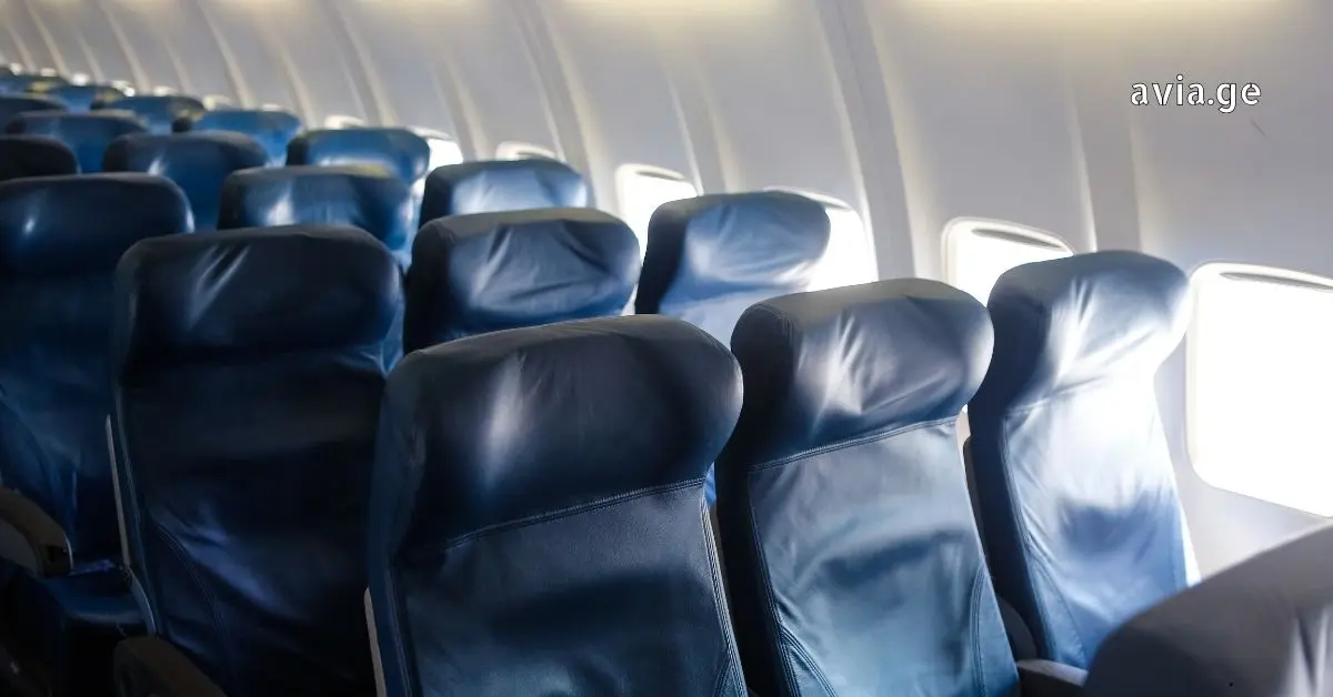 Unoccupied airplane seats symbolizing