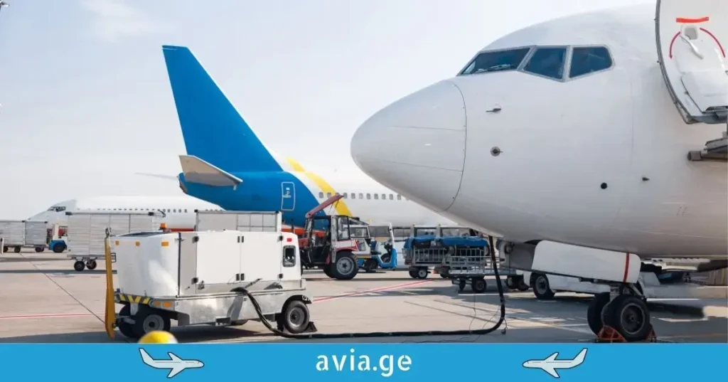 Airplanes being refueled at the airport tarmac.
