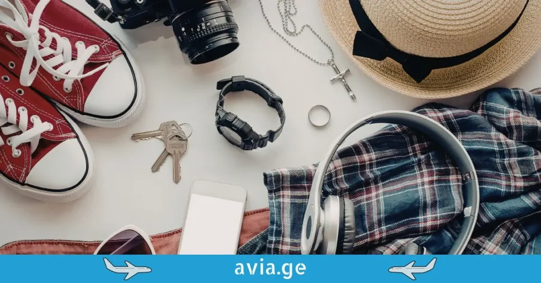 Travel Gear and Essential Items for Flight Top down view of travel accessories including red sneakers, headphones, a camera, a wrist watch, and a smartphone on a white background.