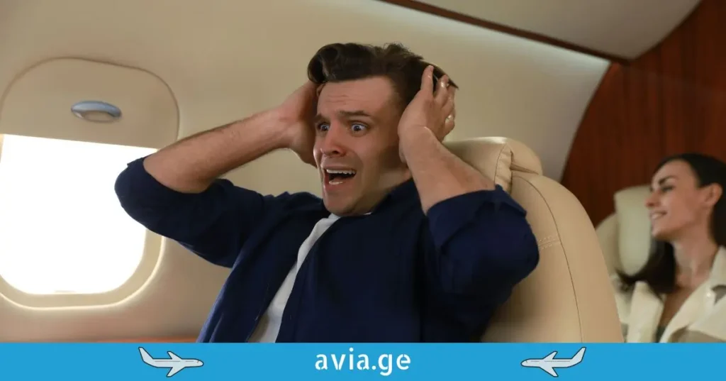 Scared man on a plane