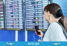 რა უნდა გავაკეთოთ, თუ ავიაკომპანიამ რეისი გადადო? გზამკვლევი მგზავრებისთვის Passenger checking flight status at airport